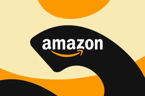 The image shows the Amazon logo with a black abstract shape in the background. The logo features the word "amazon" in white lowercase letters, with an orange arrow curving from the "a" to the "z," forming a smile. The background includes orange and beige shapes. - Cuponsy